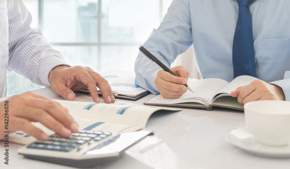 financial worker analyzing statistical data on desk in office. Accounts concept. financial worker analyzing statistical data on desk in office. Accounts concept.