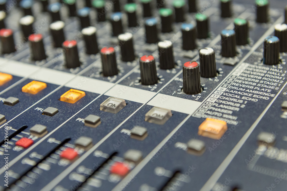 close up to the mixer table or fader board for music production process