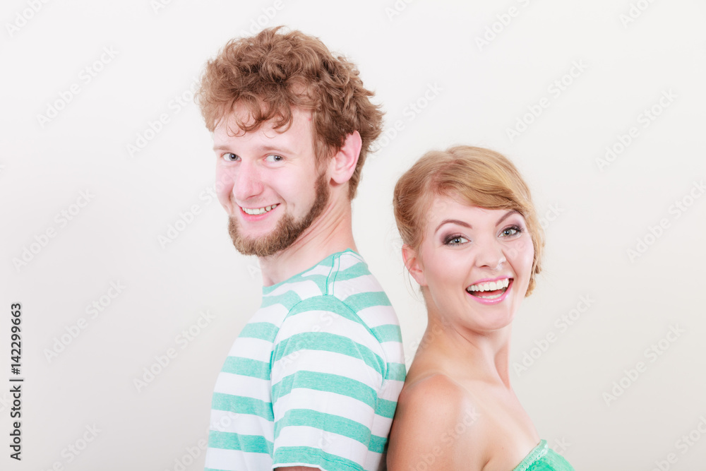 Loving couple man kissing his girlfriend in cheek Loving couple man kissing his girlfriend in cheek