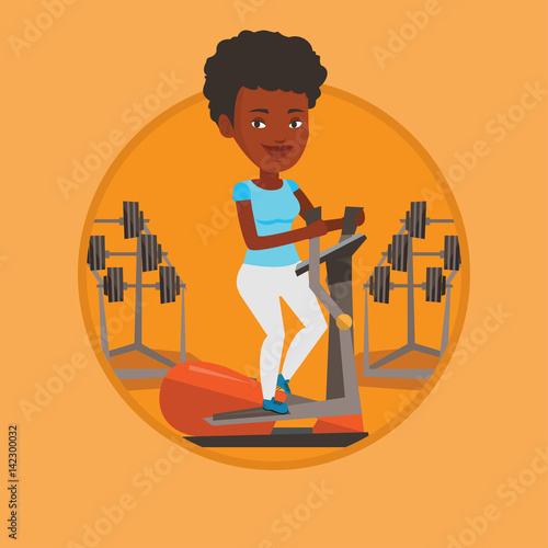 Woman exercising on elliptical trainer.