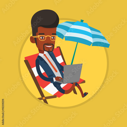 Businessman working on laptop on the beach.