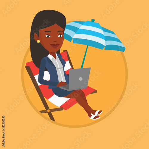 Businesswoman working on laptop at the beach.