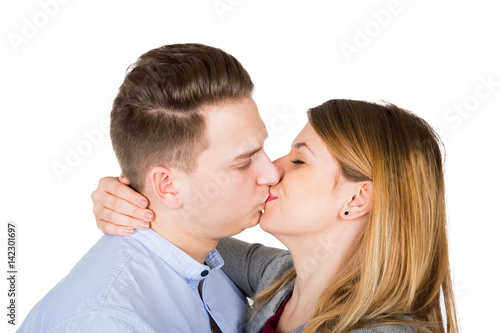 Young couple kissing - isolated