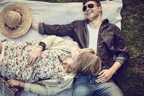 Vintage style portrait of a happy young couple photo