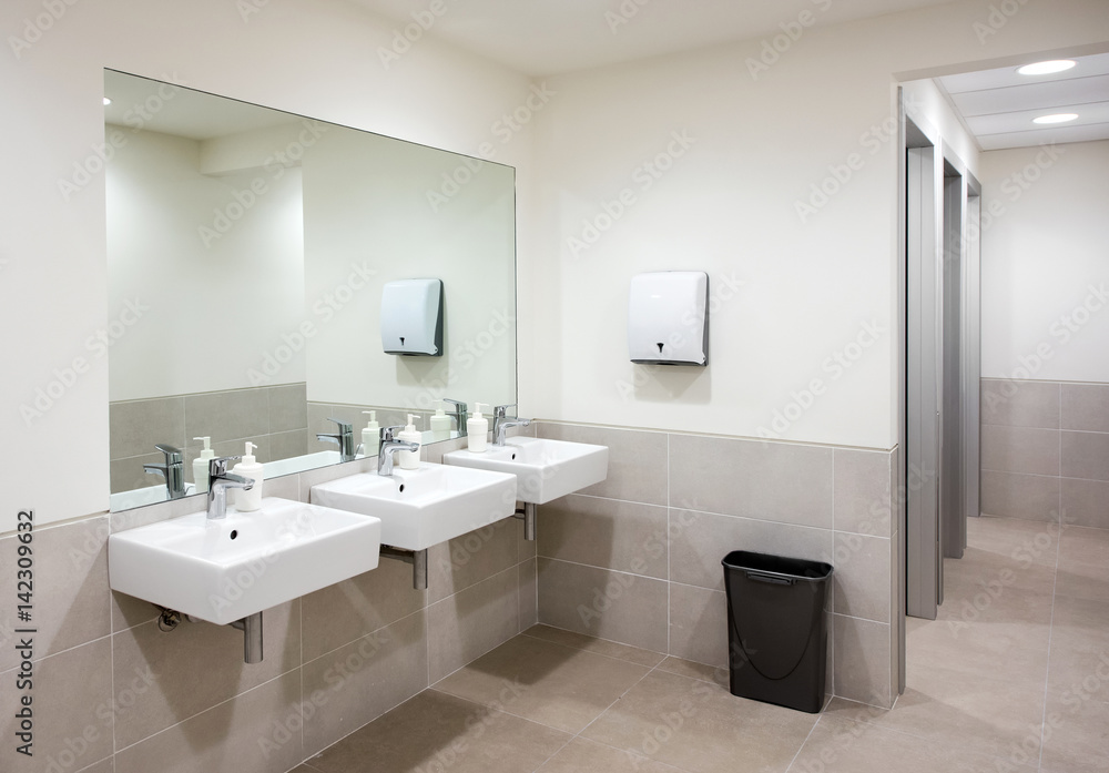 Public bathroom or restroom with hand basins Public bathroom or restroom with hand basins