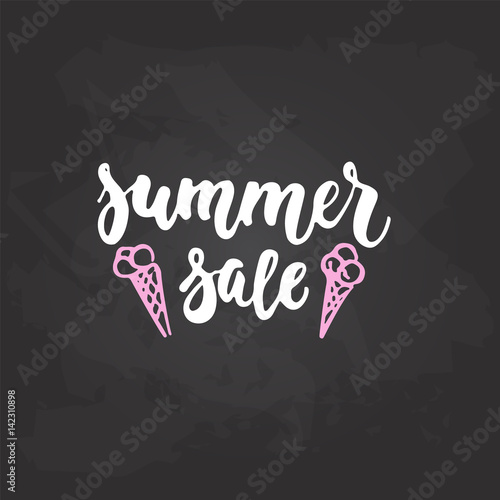 Summer Sale - hand drawn lettering phrase on the black chalkboard background. Fun brush ink inscription for photo overlays, greeting card or t-shirt print, poster design.