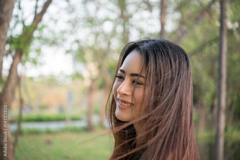 Portrait of a smiling girl relaxing in nature park outdoors. Portrait of a smiling girl relaxing in nature park outdoors.