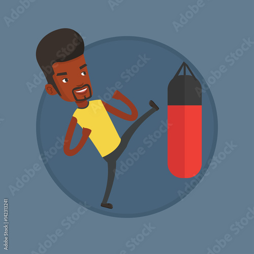 Man exercising with punching bag.