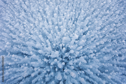 Gas bubbles. of Baikal lake. Winter texture