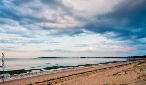 Cloudy morning on a sandy beach - minimalistic landscape view