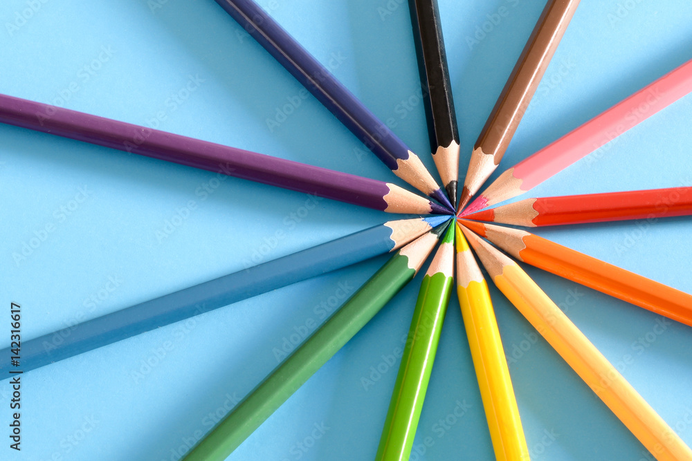 Multicolored pencils isolated on blue background Multicolored pencils isolated on blue background