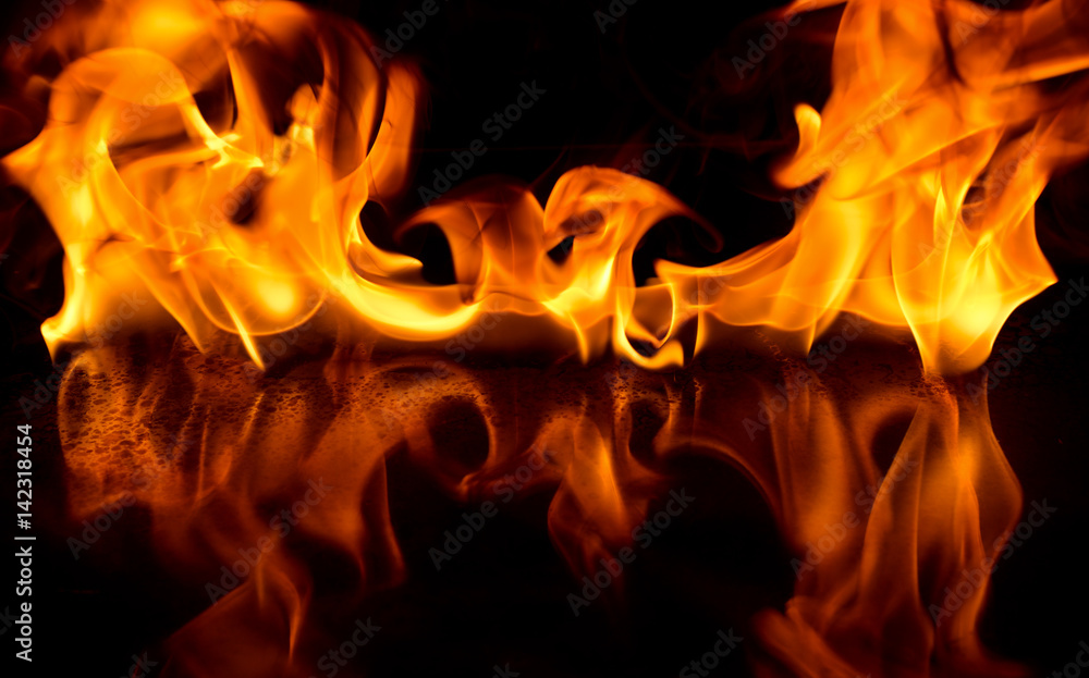 Fototapeta premium Art abstract fire flame on black background