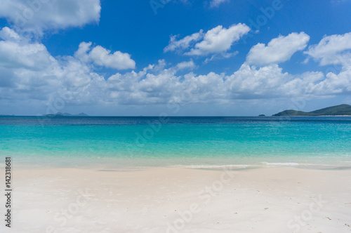 Tropical island beach with white sand. Summer vacation background © Olga K
