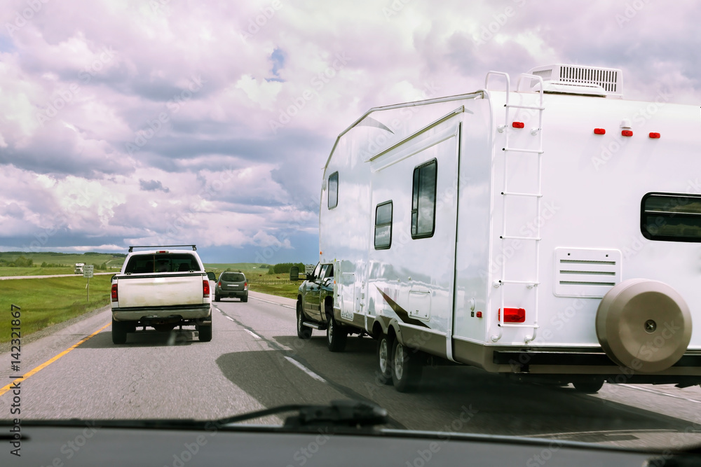 RV and cars on road