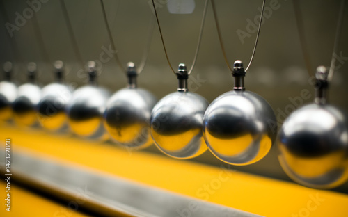 Row of metallic balls for inertia experiments photo