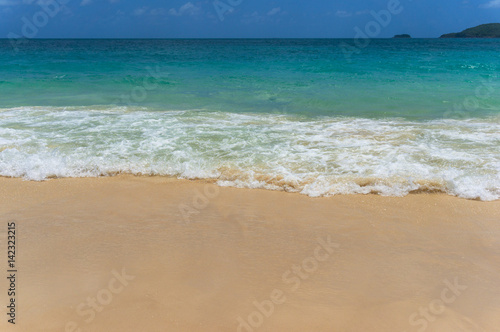 Beautiful tropical beach and sea wave on sandy shore