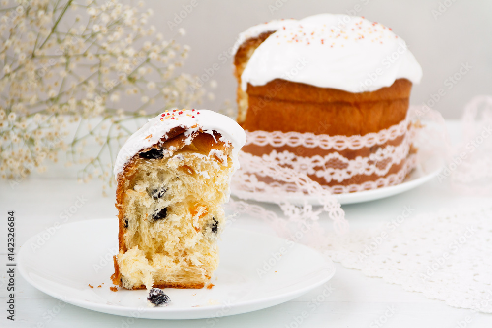 Easter cake on a table. Traditional orthodox christian easter food. Side view, selective focus Easter cake on a table. Traditional orthodox christian easter food. Side view, selective focus