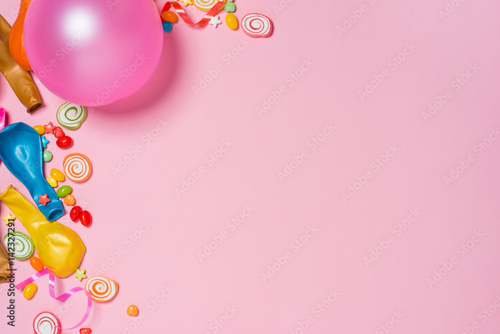 Celebration Flat lay. Candy with colorful party items on pink background. Celebration Flat lay. Candy with colorful party items on pink background.