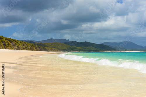 Beautiful tropical beach and sea wave on sandy shore