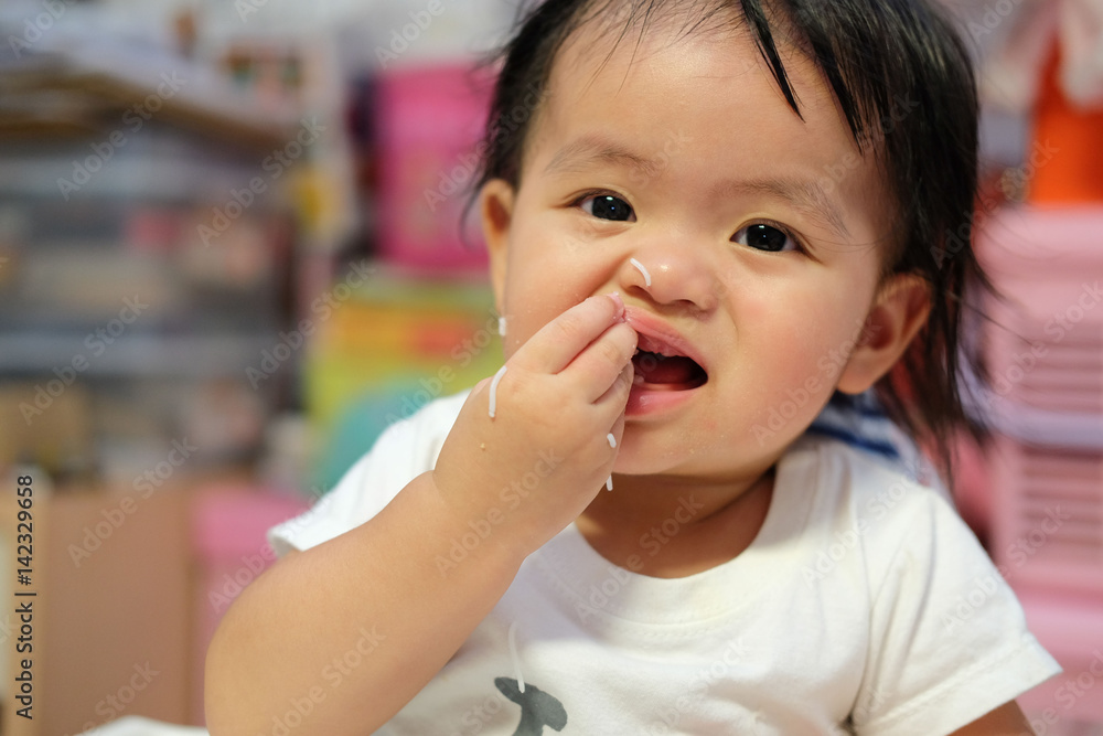 Happy baby eating himself. Asian cute baby eating food. Happy baby eating himself. Asian cute baby eating food.