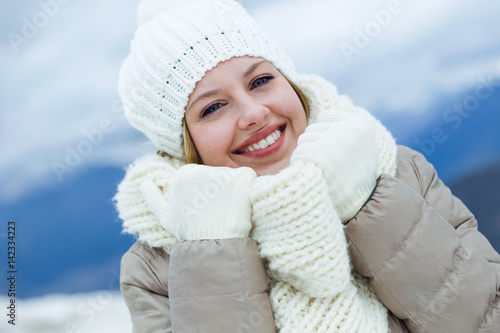 Smiling beautiful young woman in winter time. © nenetus