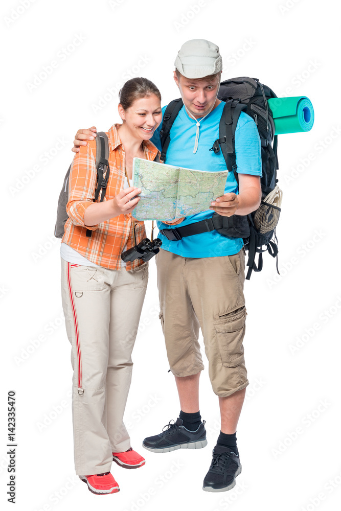 Happy woman and surprised man with a map with backpacks on a white background Happy woman and surprised man with a map with backpacks on a white background
