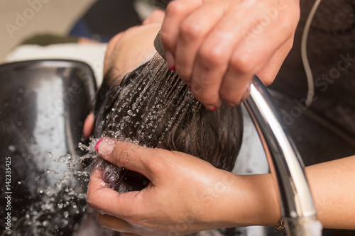 Washing of female hair © schankz