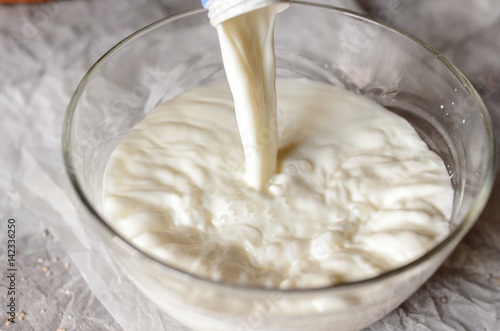 The milk is poured in a glass dish.