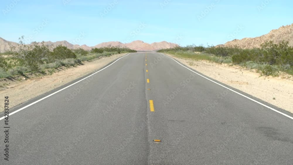 Zoom Out of Scenic Empty Desolated Road in the Mojave Desert Zoom Out of Scenic Empty Desolated Road in the Mojave Desert