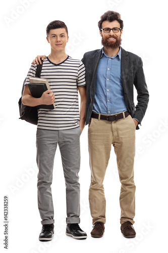 Teenage boy with a backpack and a young man