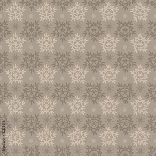 Abstract seamless beige and brown snowflake vector pattern.
