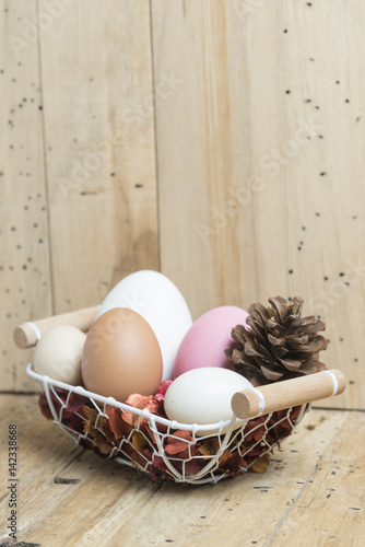 Easter eggs on wooden backg...