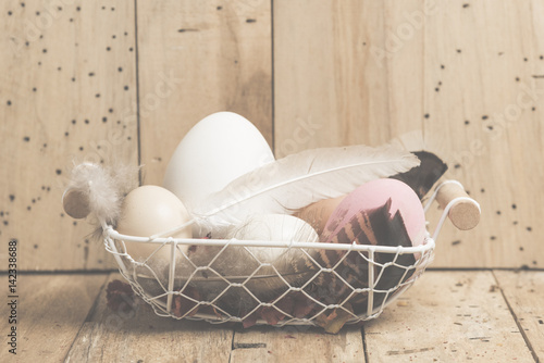 Easter eggs on wooden backg...