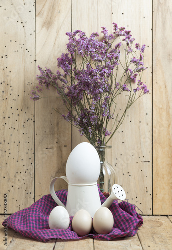 Easter eggs on wooden backg...