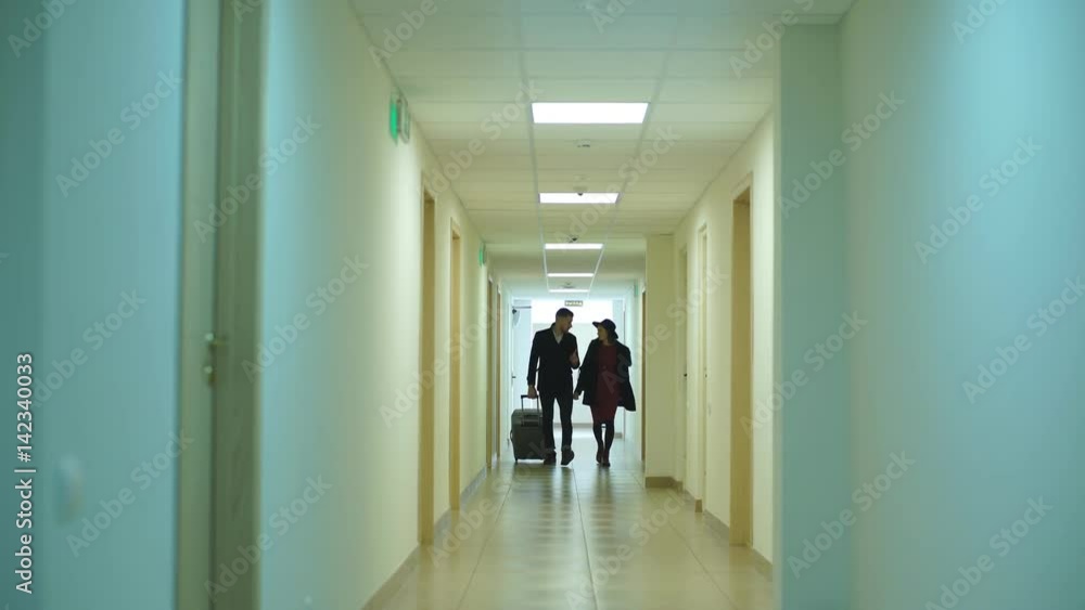 a young couple arrive at the hotel a young couple arrive at the hotel