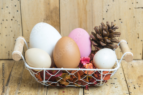 easter eggs in a basket wit...