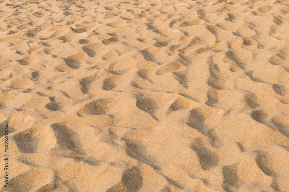 Fototapeta premium texture of sand pattern on a beach in the summer at Phuket, Thailand