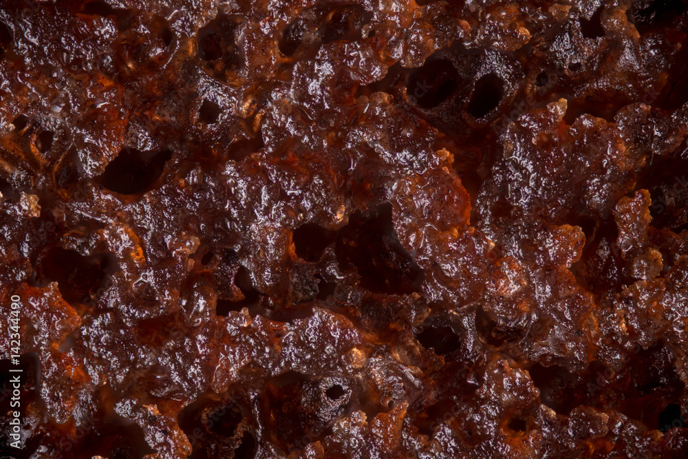 Microscopic texture of a chocolate cake as a graphic resource for backgrounds and textures Microscopic texture of a chocolate cake as a graphic resource for backgrounds and textures