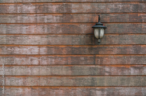 Old wooden background texture with old lamp for your design. photo