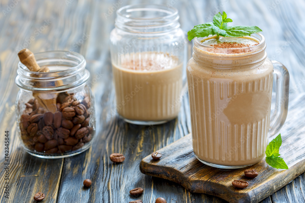 Coffee smoothie with banana and yogurt in a glass mug. Coffee smoothie with banana and yogurt in a glass mug.