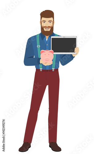 Hipster holding a piggy bank and digital tablet