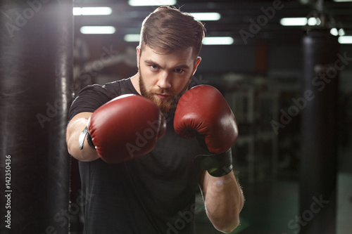 Concentrated handsome young strong sports man boxer © Drobot Dean