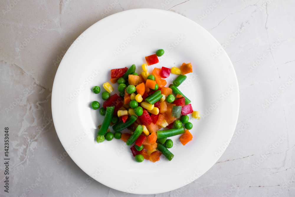 Mixed vegetables on a wooden table in rustic style Mixed vegetables on a wooden table in rustic style