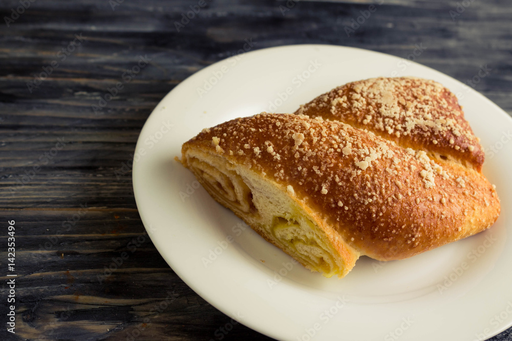 Austrian strudel with lemon and orange jam on a wooden table in rustic style Austrian strudel with lemon and orange jam on a wooden table in rustic style