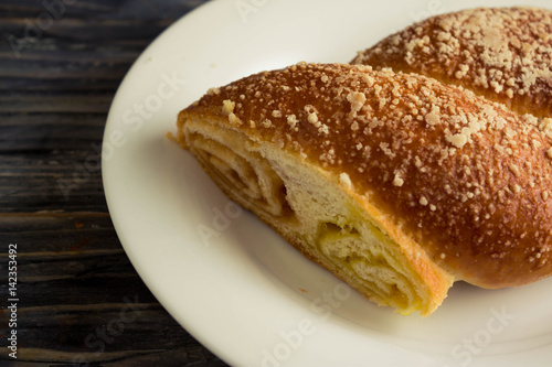 Austrian strudel with lemon and orange jam on a wooden table in rustic style