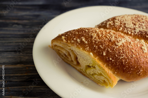 Austrian strudel with lemon and orange jam on a wooden table in rustic style