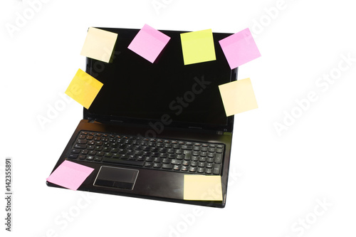 laptop covered in colorful blank post it notes
