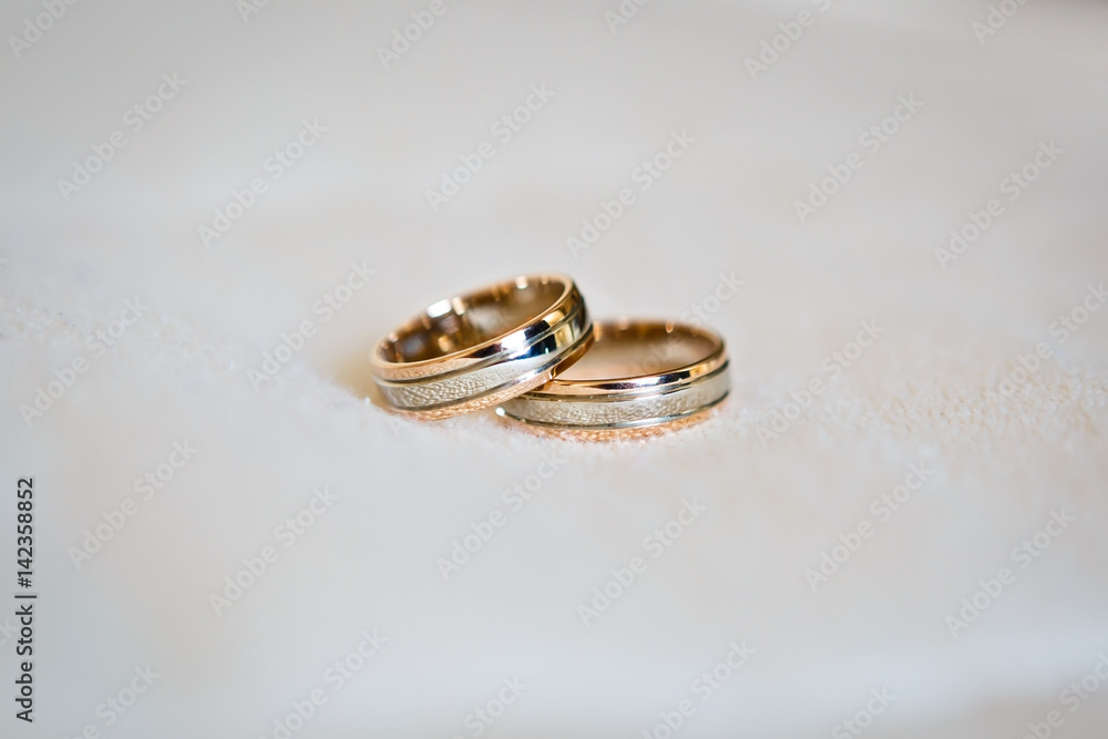 Two wedding rings close up. Wedding symbols, attributes. Holiday, celebration. Macro Two wedding rings close up. Wedding symbols, attributes. Holiday, celebration. Macro
