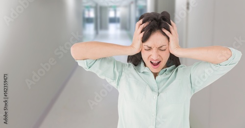 Woman stressed in hospital corridor