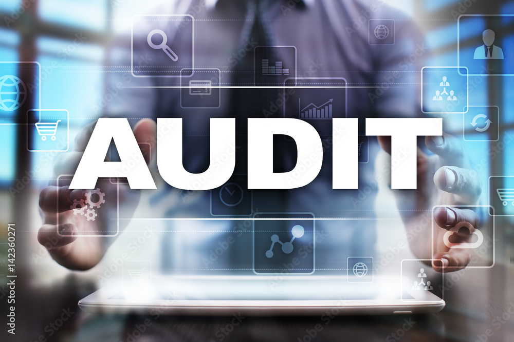 Businessman using tablet pc and selecting audit. Businessman using tablet pc and selecting audit.